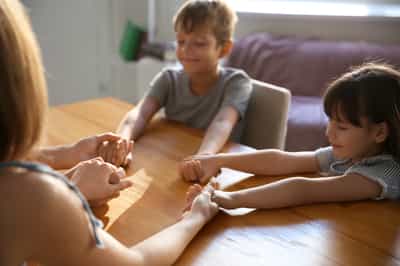Family praying at home