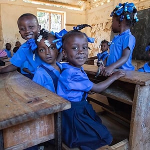 children sitting at school desks